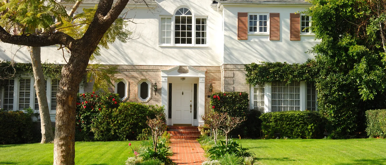 After full home remodeling project in Los Angeles with restored exterior, refreshed curb appeal, clean landscaping, updated front entry, and improved residential property value