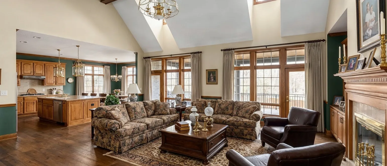 Before luxury home remodeling project in Los Angeles showing dated living room, old wood finishes, traditional kitchen, heavy furniture, and outdated interior layout before renovation
