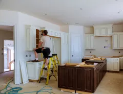 Kitchen remodeling service in Los Angeles with custom cabinets, premium countertops, open layout design, and modern lighting