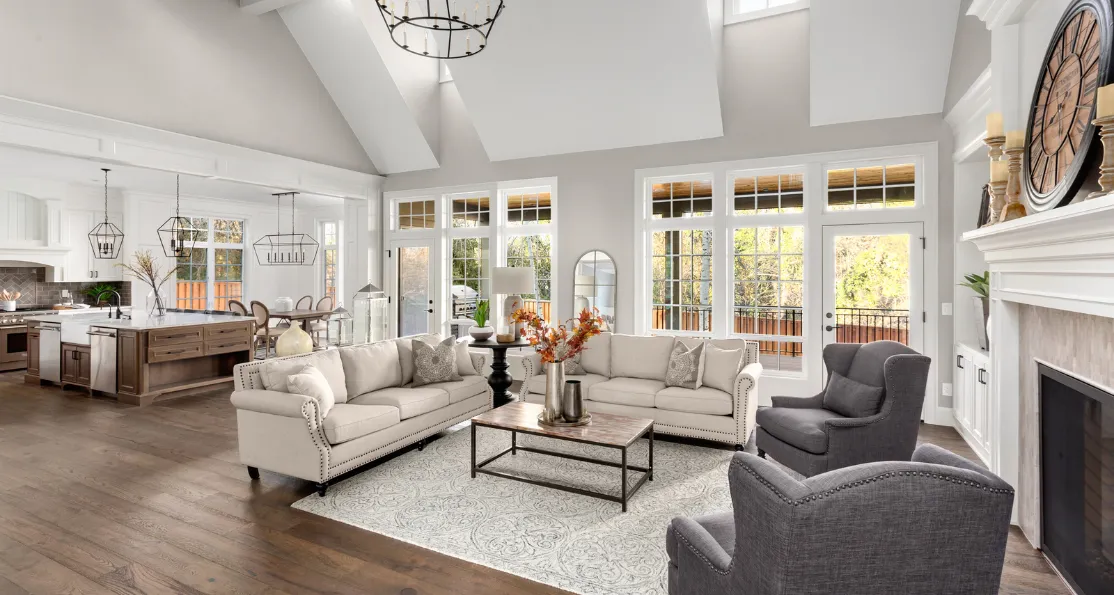 Luxury home remodeling project in Los Angeles with open-concept living room, high ceilings, premium kitchen view, fireplace feature wall, natural light, and elegant interior design